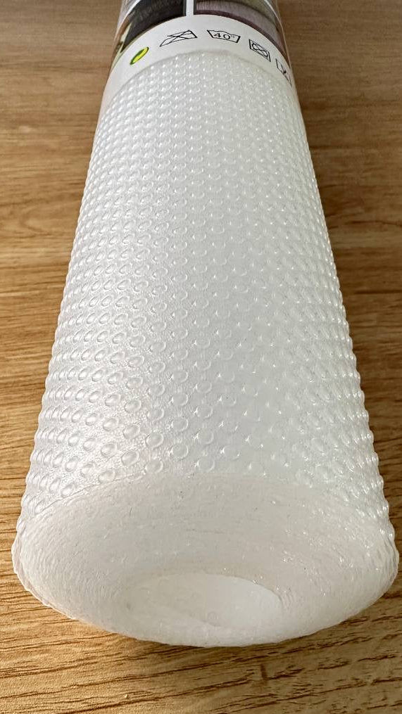 Roll of bubble wrap on a wooden surface