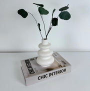 Ribbed vase with plant