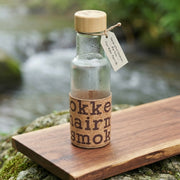 Glass bottle with wooden cap